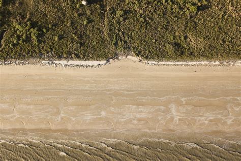 The Texas coastline is slowly disappearing. Here's how one community is coping. | The Texas Tribune