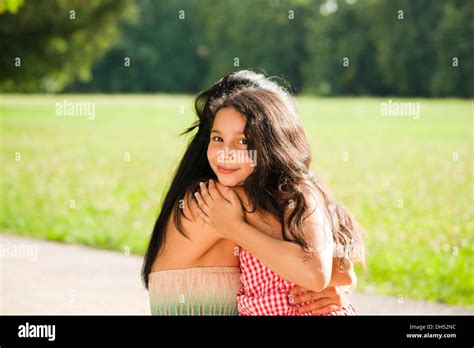 Girl lovingly hugging her mother Stock Photo - Alamy