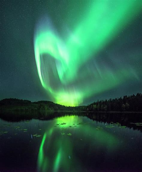 Aurora Borealis Over A Lake Photograph by Tommy Eliassen/science Photo ...