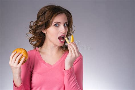 Young Beautiful Girl with a Sandwich and a French Fries from a F Stock Image - Image of healthy ...