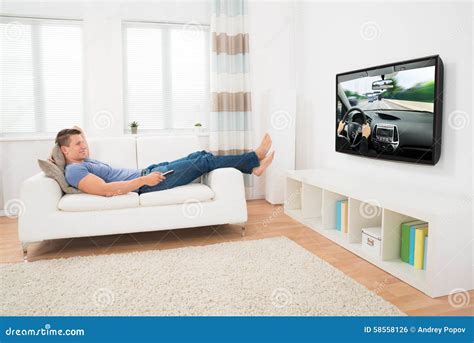 Man Watching Movie at Home stock photo. Image of lifestyle - 58558126