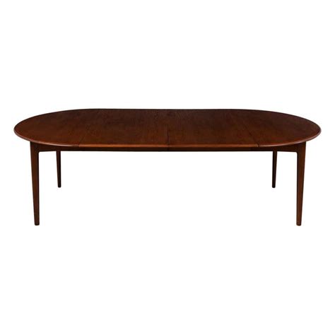 Danish mid century modern rosewood pedestal oval dining table. at 1stdibs