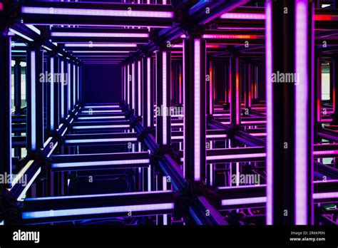 Futuristic purple, violet neon light cube art installation. Technology cyber cube, Sci fi shape ...