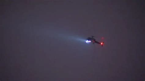 Police helicopter flying at night with f... | Stock Video | Pond5