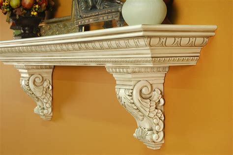 A heavy, large mantel shelf with solid wood acanthus leaf corbels