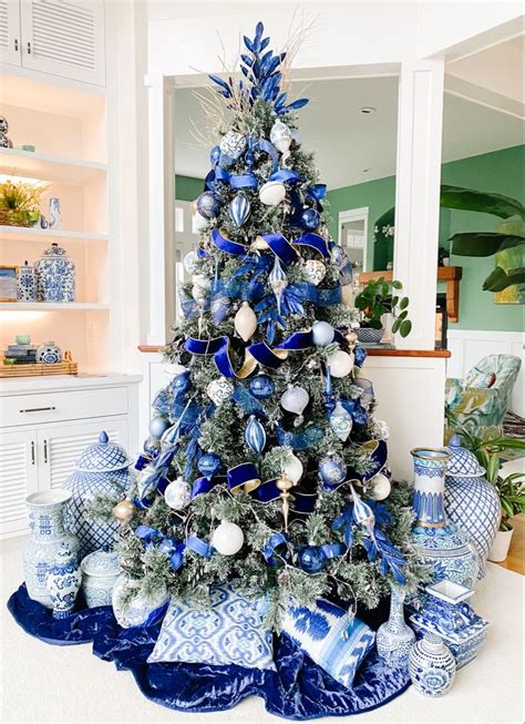 a blue and white christmas tree with ornaments