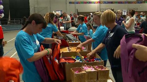 Cradles to Crayons volunteers pack 40,000 backpacks for kids