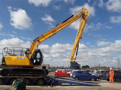 long reach excavator being delivered on site - Salix