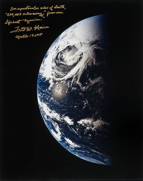 Bonhams : APOLLO 13 EARTH AFTER TRANS-LUNAR INJECTION MANEUVER. Large format color photograph ...