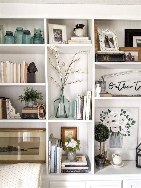 A built-in bookcase library wall anchors this 1920 farmhouse living ...