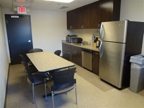 Employee break room with custom cabinetry and vct flooring | Office break room, Break room ...