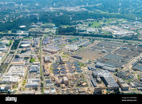 Plane aerial drone view of cityscape near Washington DC with Blue Plains water treatment plant ...