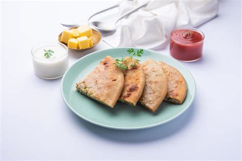 Aloo Gobi Paratha 16584901 Stock Photo at Vecteezy