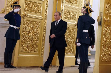 Vladimir Putin's funny walk 'the result of Russia's KGB training' not Parkinson's or stroke