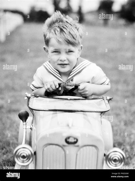 Child in peddle car Black and White Stock Photos & Images - Alamy