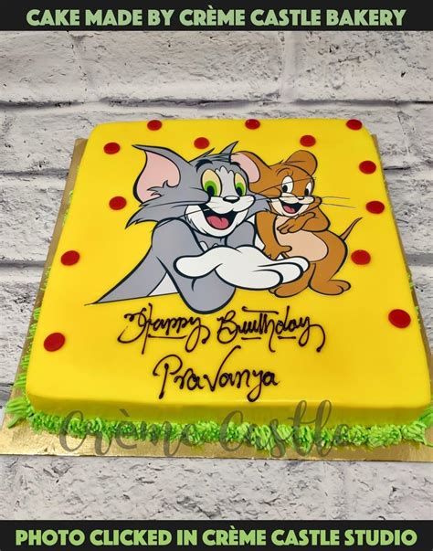 A yellow color theme Classic cartoon theme cake with Tom and Jerry ...