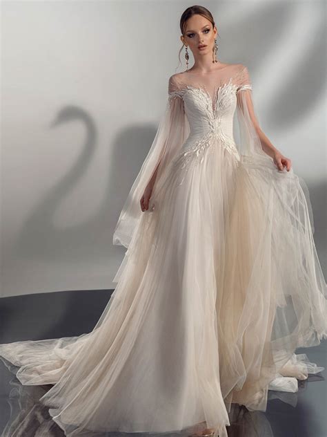 A-line wedding dress with cape sleeves