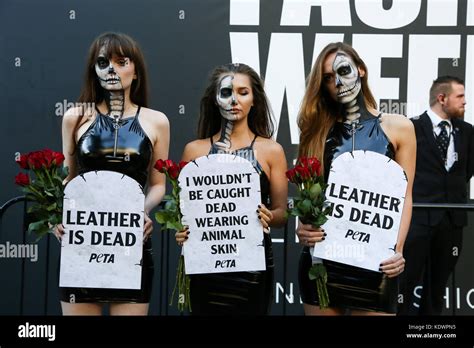 PETA (People for the Ethical Treatment of Animals) activists wearing skin-tight vegan leather ...