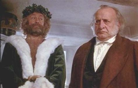 Edward Woodward as the Ghost of Christmas Present and George C. Scott as Ebenezer Scrooge f ...