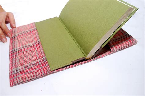 Sew a Fabric Book Cover, add handles to both sides,and elastic on both ...