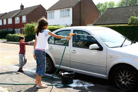 Children washing the car stock photo. Image of discipline - 3151682