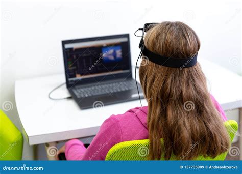 Young Teenage Girl during EEG Neurofeedback Session ...