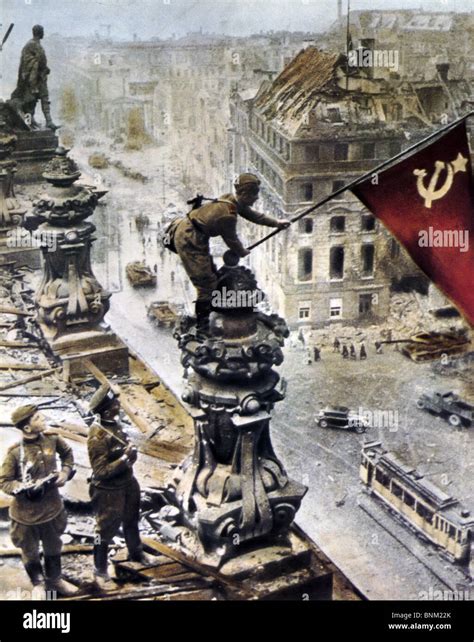 RUSSIANS RAISE FLAG OVER BRANDENBURG GATE, April 1945. A colourised version of one of the most ...