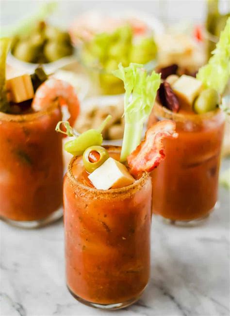 three bloody marys with toppings