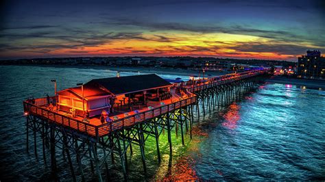 Garden City Pier Glowing Sunset Photograph by Robbie Bischoff - Pixels