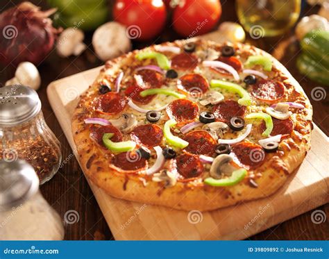 Supreme Italian Pizza with Pepperoni and Toppings Stock Photo - Image ...