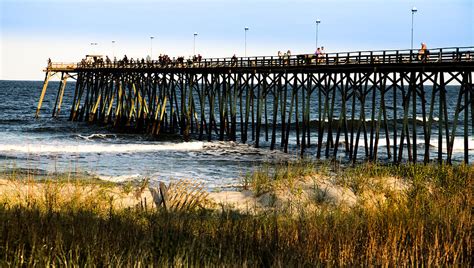 Carolina Beach Fishing Pier Photograph by Karen Wiles - Fine Art America