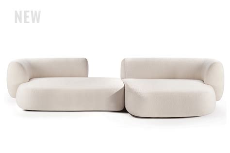 two white couches sitting next to each other on top of a white flooring