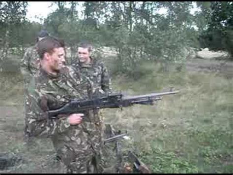 Firing a GPMG from the hip - YouTube