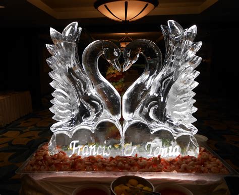 Double swans forming a heart with bride and groom names | Ice sculpture wedding, Ice sculptures ...