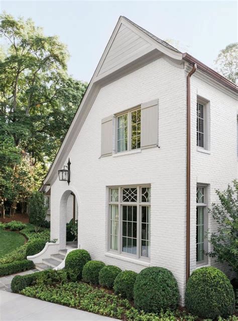 Discover the Charm of a White Brick House with White Shutters - See ...