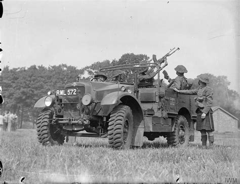 Morris-Commercial 15 cwt truck and men of the 1st Battalion Cameron Highlanders practise with a ...