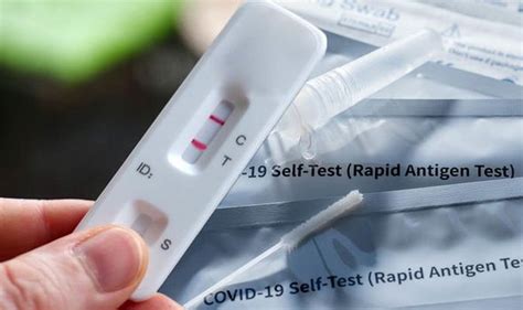 Does a faint line on a lateral flow test mean you have Covid? What to ...