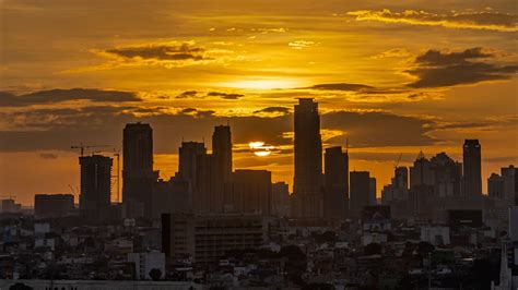 Download wallpaper 2560x1440 sunset, city, buildings, dusk, view widescreen 16:9 hd background