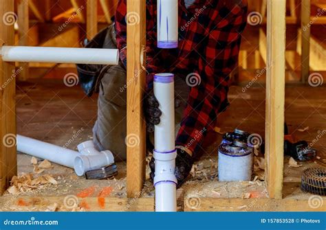 Plumber Installing Primer and Glue PVC Pipe at Construction Home Stock Photo - Image of ...