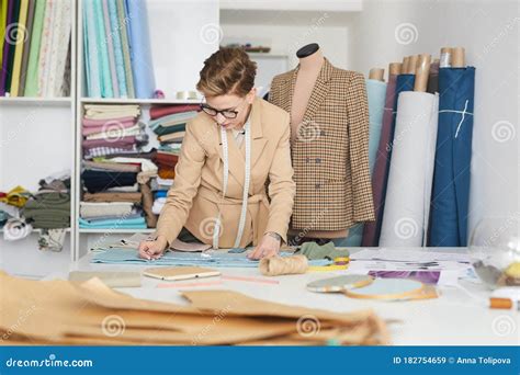 Tailor making clothes stock image. Image of eyeglasses - 182754659