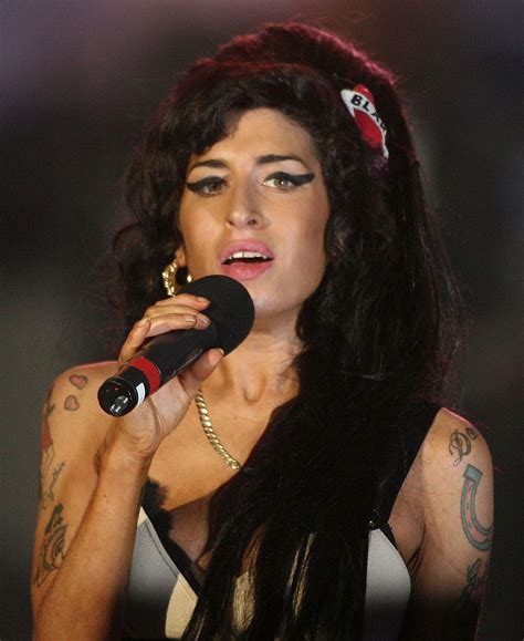 Amy Winehouse laatste foto's: bekijk haar onvergetelijke momenten nu!