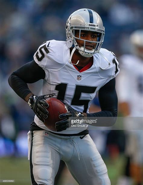 Wide receiver Michael Crabtree of the Oakland Raiders warms up prior... | Oakland raiders ...