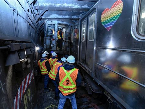 New York City subway train derails in collision with another train, injuring more than 20 people