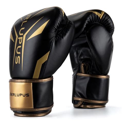 two black and gold boxing gloves sitting on top of each other