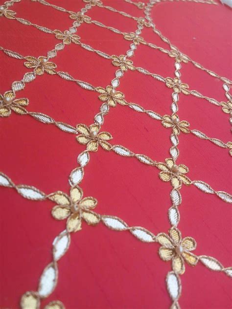 a red table with gold designs on it