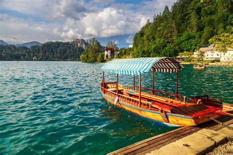 Traditional Wooden Boats Pletna on Lake Bled Stock Image - Image of ...