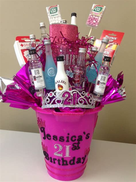 a pink bucket filled with lots of bottles and condiments on top of a table