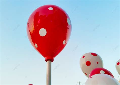 Red And White Fake Balloons Under The Blue Sky Background, Blue Sky ...