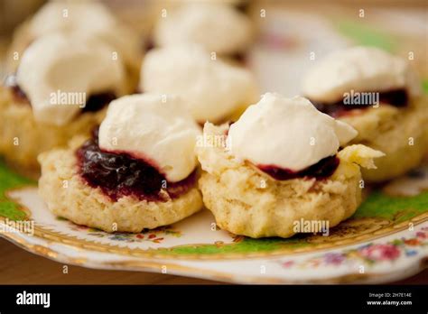 Scones with strawberry jam and cream Stock Photo - Alamy