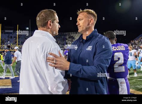 James Madison coach Curt Cignetti, left, meets with Old Dominion coach ...